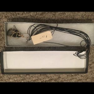 Gold and black pendant necklace